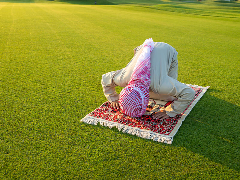 muslim man praying outdoor 