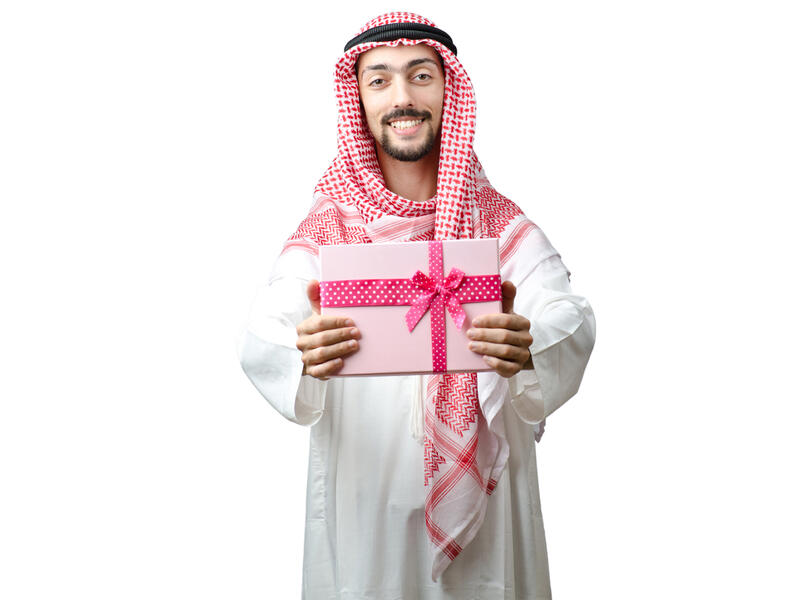 arab man giving gift 