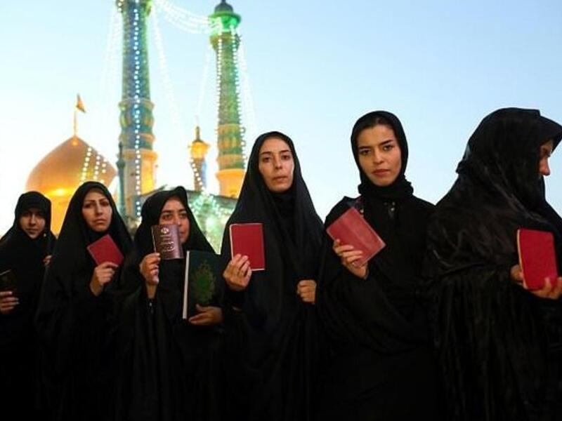 Iranian women are barred from showing their hair—though not everyone's very strict about it. (AFP)