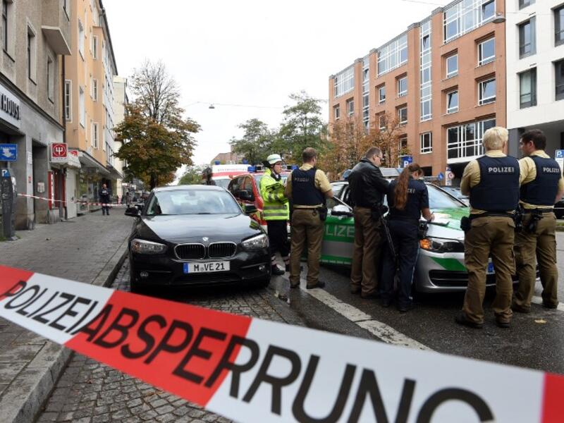 German police stands inside a security perimeter set after a man attacked passersby near Rosenheimer square in the southern German city of Munich on October 21, 2017 (Christof Stache/AFP)
