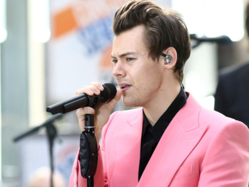 The former One Direction singer, 24, looked completely smitten with the baby as he gazed lovingly at it, giving a big smile as he enjoyed a walk in London this week. (Source: JStone - Shutterstock)