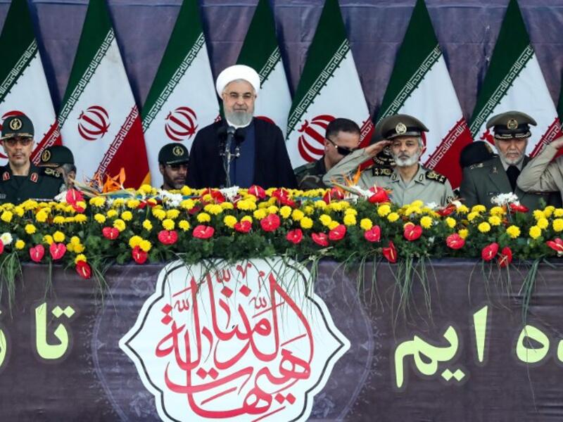 Iranian President Hassan Rouhani delivers a speech during the annual military parade marking the anniversary of the outbreak of the devastating 1980-1988 war with Saddam Hussein's Iraq, in the capital Tehran on September 22, 2018. (STRINGER / AFP) 