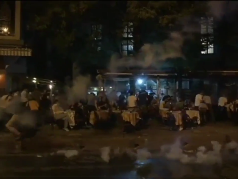 Gay pride supporters are fired upon with tear gas by Turkish forces. (Twitter/@b9AcE)