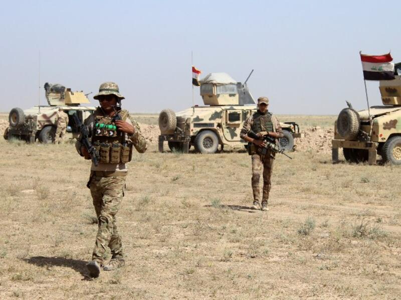 Iraqi forces near Falluja. (photo: AFP)
