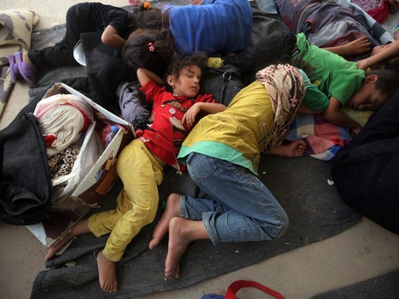 Iraqi children displaced from the city of Fallujah sleep at a newly opened camp where hundreds of displaced Iraqis are taking shelter in Amriyat al-Fallujah on June 27, 2016, south of Fallujah. (AFP/Ahmad al-Rubaye)