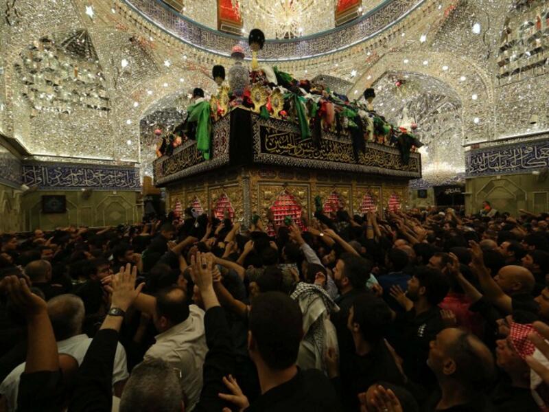 Iraqi Shias pray inside the Imam Abbas shrine in commemoration of the tenth day of the mourning period of Muharram, which marks the day of Ashura, in the holy city of Karbala on October 11, 2016. (AFP/Mohammed Sawaf)