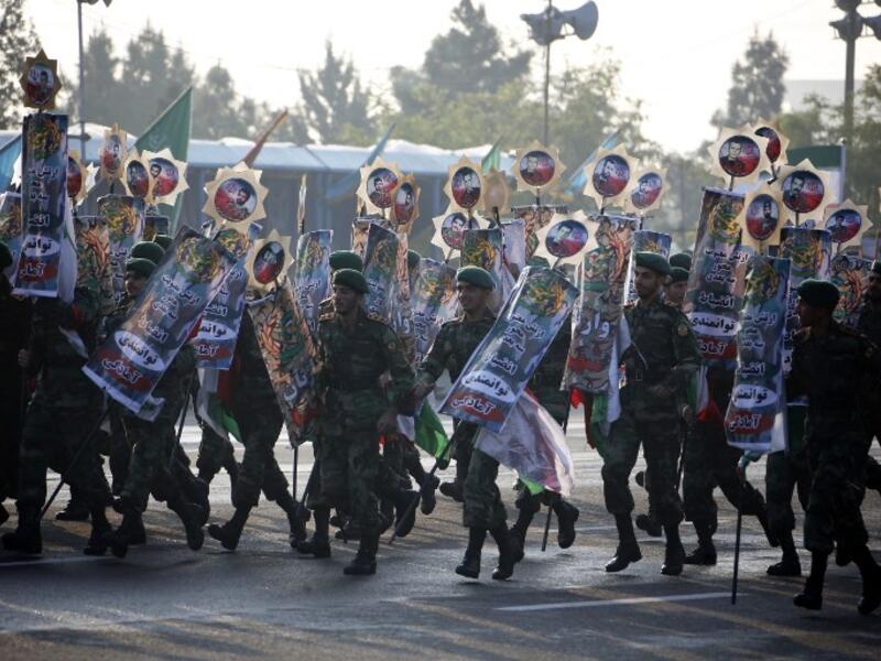 Iranian soldiers play during a parade on the occasion of the country's annual Army Day on April 18, 2018 in Tehran. ATTA KENARE / AFP