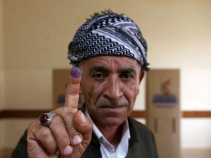 An Iraqi Kurdish man shows his ink-stained finger after voting in the Kurdish independence referendum in Arbil. (AFP/ File Photo)