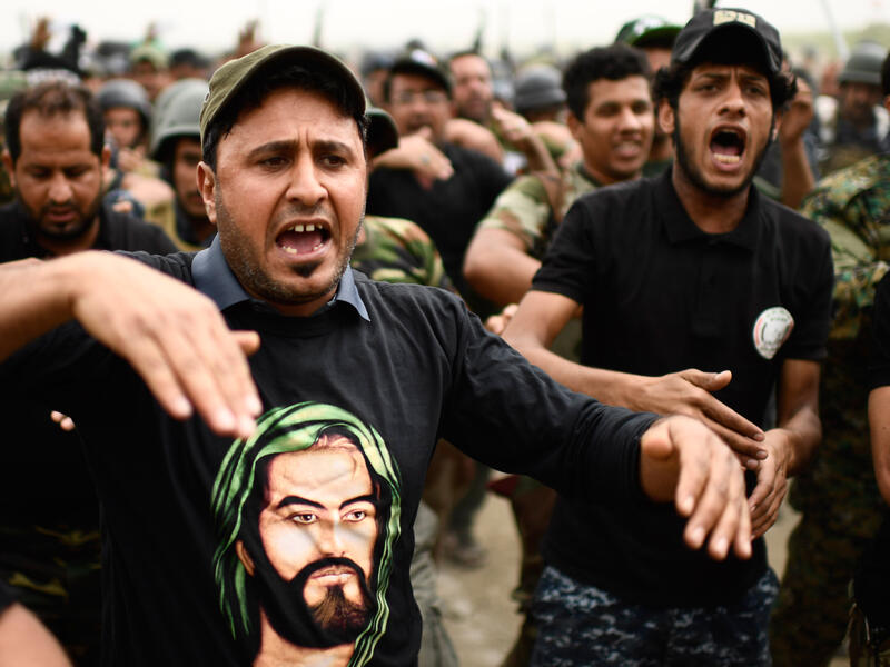 Some leading figures - such as Prime Minister Haider al-Abadi and powerful Shia cleric Muqtada al-Sadr - oppose the participation of Hashd in the elections. (AFP) 