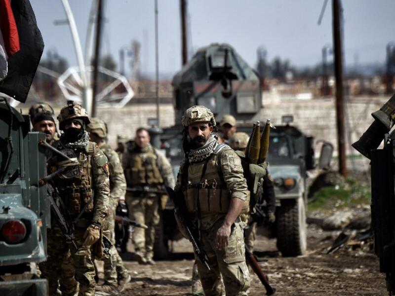 Iraqi forces gather in position as they prepare for clashes with Daesh fighters in Mosul on March 5, 2017. (AFP/Aris Messinis)