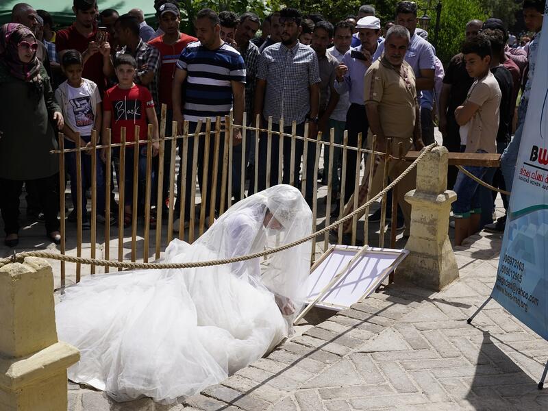 This photo shows that woman subjected to rape in Iraq are forced to obey Article 398 which allows rapist men to marry their victims, which limits women's right. 
Baghdad's Woman Association