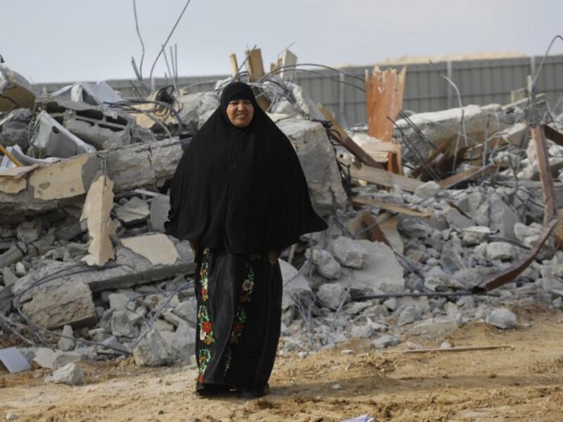 A Bedouin woman cries following the destruction of houses on January 18, 2017 in Umm al-Hiran (Menahem Kahana/AFP)