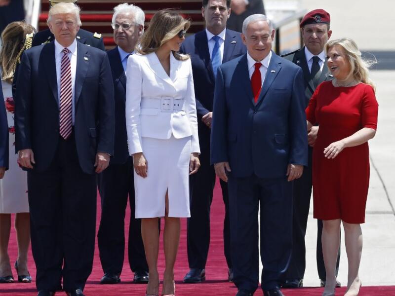 US President Donald Trump (L), First Lady Melania Trump, Israeli Prime Minister Benjamin Netanyahu (C) and his wife Sara are seen upon Trump's arrival at Ben Gurion International Airport in Tel Aviv on May 22, 2017, as part of his first trip overseas. (AFP/Jack Guez)