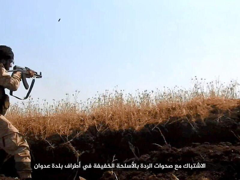 A JKW fighter pictured in the group's propoganda, Twitter