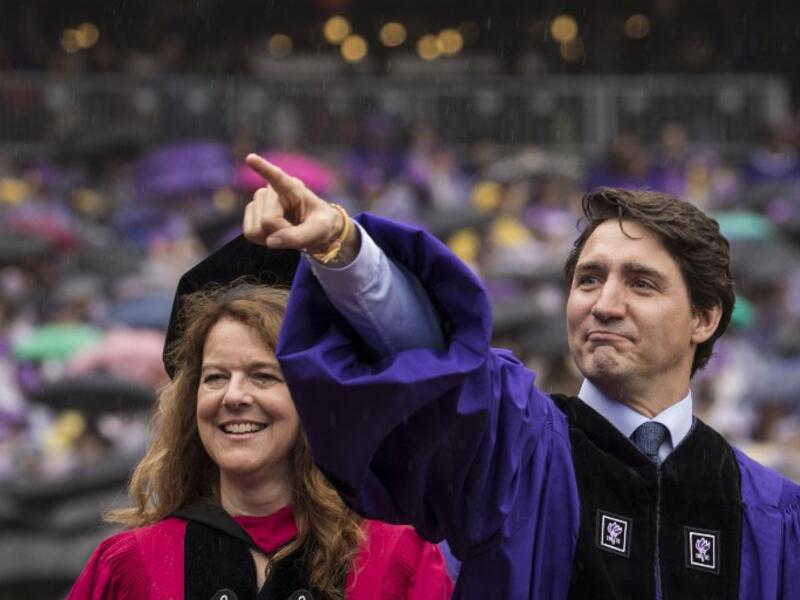 Canadian Prime Minister Justin Trudeau gestures as he arrives for New York University's commencement ceremony/AFP