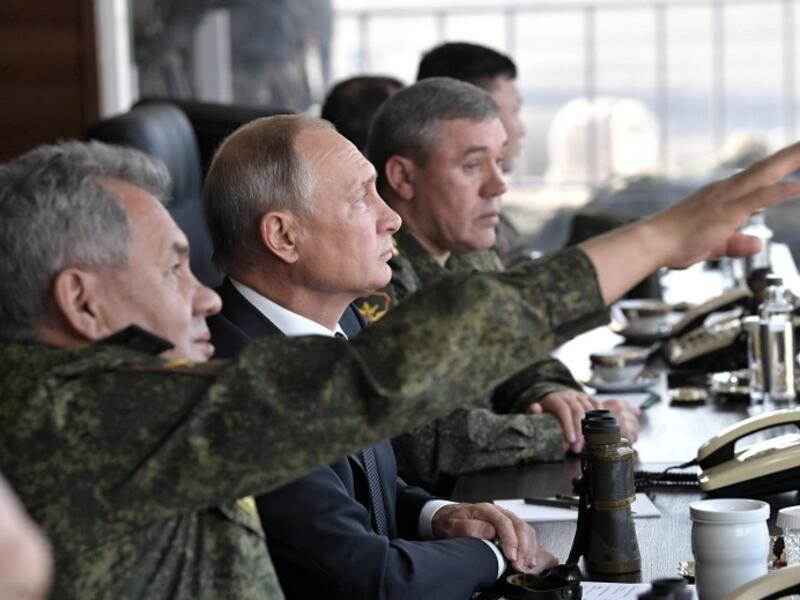 Russia's President Vladimir Putin (C), Defence Minister Sergei Shoigu (L) and Chief of the General Staff of the Russian Armed Forces Valery Gerasimov watch the Vostok-2018 (East-2018) military drills at Tsugol training ground not far from the Chinese and Mongolian border in Siberia, on September 13, 2018. 
Alexey NIKOLSKY / SPUTNIK / AFP
