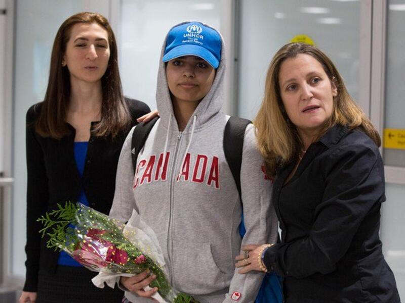 Saudi Rahaf Mohammed al-Qunun is welcomed by Canadian Minister for Foreign Affairs Chrystia Freeland as she arrives at Pearson International airport in Toronto, Ontario, on January 12, 2019. (AFP)
