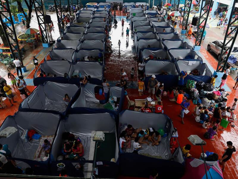 Evacuees at a temporary shelter in Marikina City, east of Manila, on Saturday. More than 100,000 have fled their homes across the Philippines (ntimes.com)