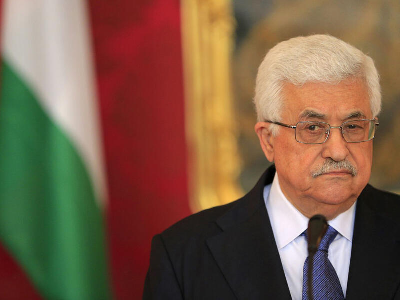 Speaking at a joint news conference, Abbas and Emmanuel Macron welcomed Thursday's UN vote against the U.S. recognition of Jerusalem as Israel's capital. (AFP/File Photo)