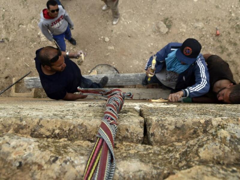 Experts and students from Algiers University’s Archaeology Institute work on one of the Jeddars pyramid tombs.
RYAD KRAMDI / AFP