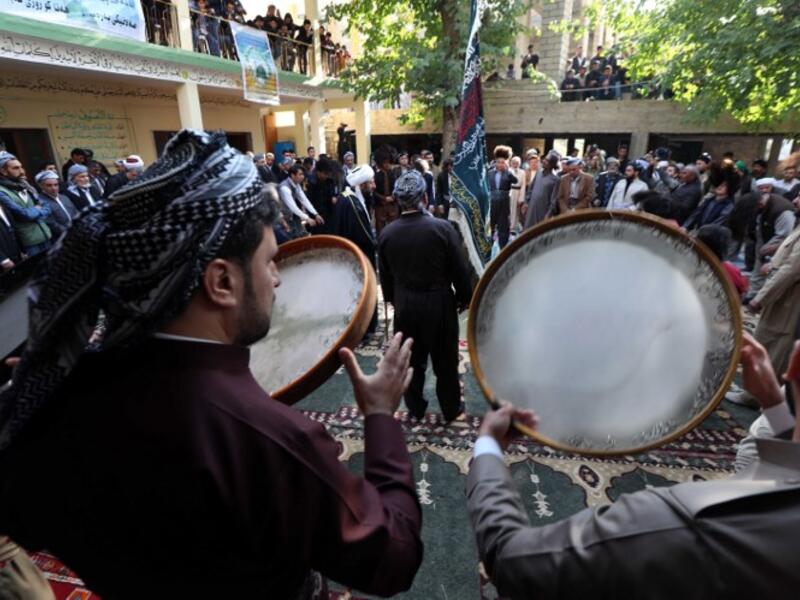 Iraqi Sufi Muslim Kurds take part in a ritual ceremony to commemorate the birth of the Prophet Mohammed in the Kurdish town of Akra. 
SAFIN HAMED / AFP