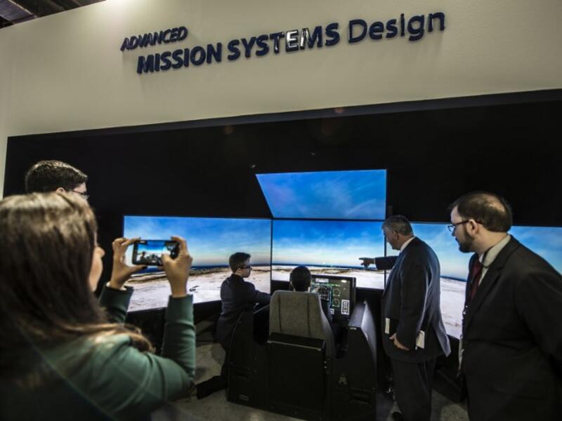An Egyptian air force pilot (C) tests the simulator of the US-made F15 jet fighter at the Boing stand in Egypt’s first Service Defence Exhibition in Cairo on December 3, 2018, at the International Exhibition Center. 
Khaled DESOUKI / AFP
