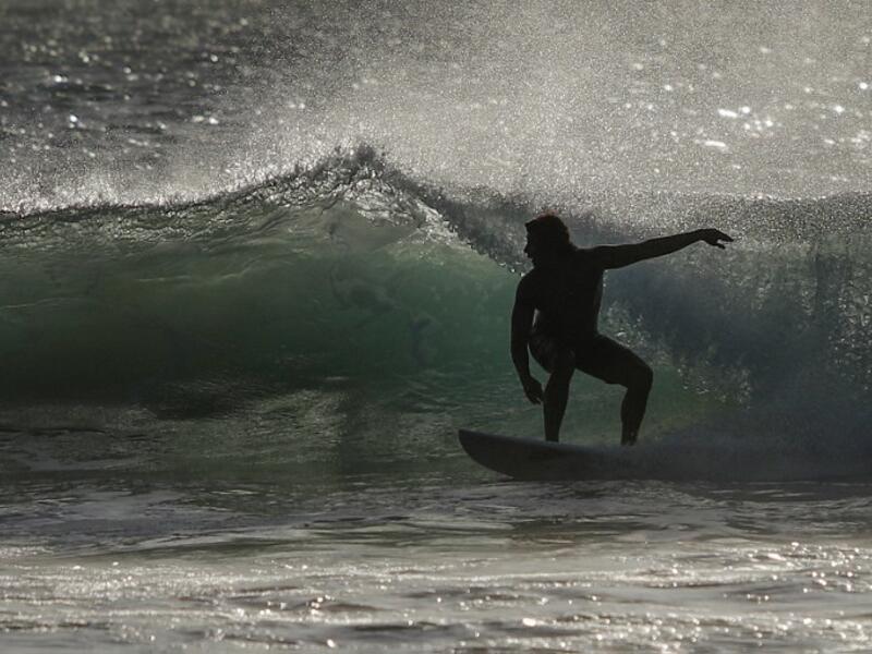 A surfer enjoys the waves at Las Baulas National Marine Park, Playa Grande, Costa Rica on December 10, 2018. David GANNON / AFP