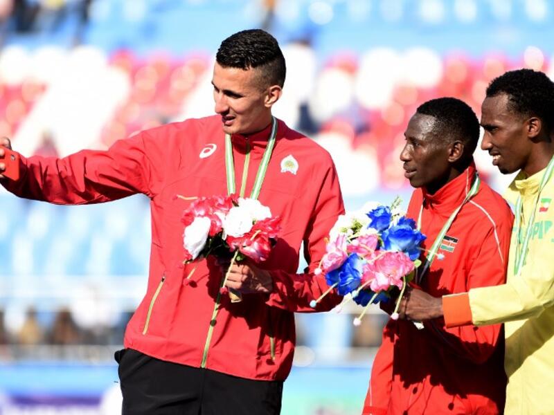 Gold medalist Kenya's Conseslus Kipruto (C), silver medalist Morocco's Bakkali Soufiane (L) and bronze medalist Ethiopia's Getnet Wale Bayabl pose for a selfie after the Men's 3000 meter Steeplechase final at the African Senior Athletics Championship in Asaba, Delta State, Midwestern Nigeria, on Aug 3, 2018.
PIUS UTOMI EKPEI / AFP