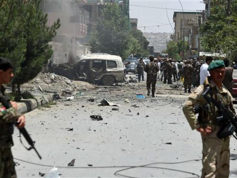 Afghan security forces stand alert at the site of a bomb blast that targeted NATO forces. (AFP/File) 