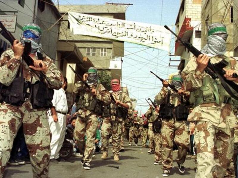 Gunmen march through Sidon's Ain al-Helweh camp. (AFP/Mahmoud Zayat)