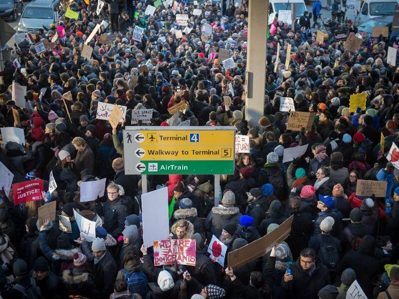 Demonstrators at JFK International Airport protest President Donald Trump's executive order suspending refugee arrivals and imposing tough controls on some travellers. (AFP/Bryan R. Smith)