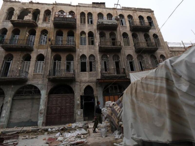 A rebel fighter monitors a street in the old city of Aleppo, Syria. (AFP/File)
