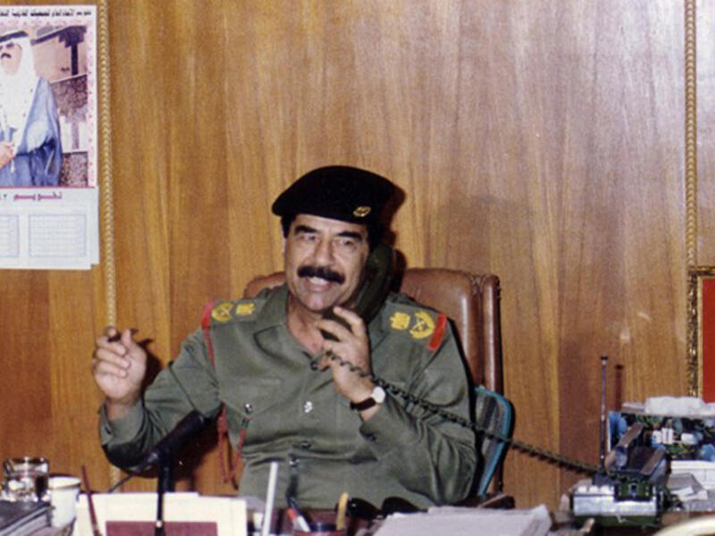 This handout dated 1991 shows toppled leader Saddam Hussein. Doesn't look like much of an Iphone he's got there. (AFP/File)