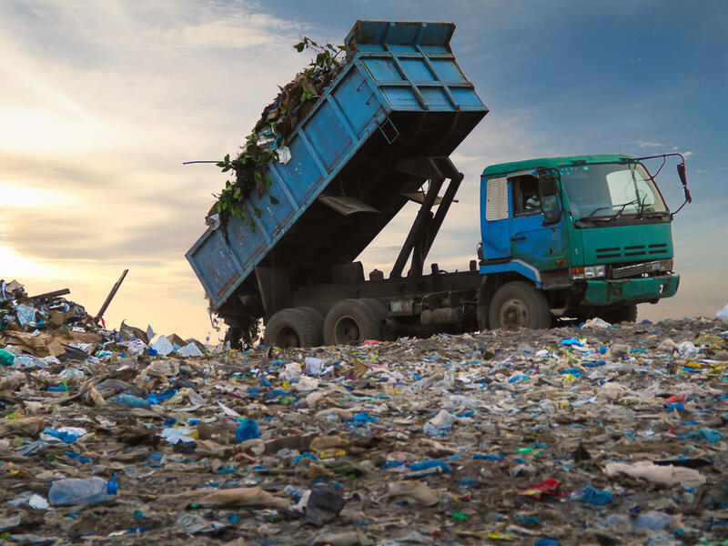 Dump truck unloading waste on a landfill. (Shutterstock/ File Photo)