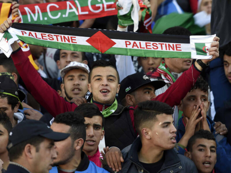 Algeria and Palestine are so close that during football matches, fans support both teams. (AFP/File)