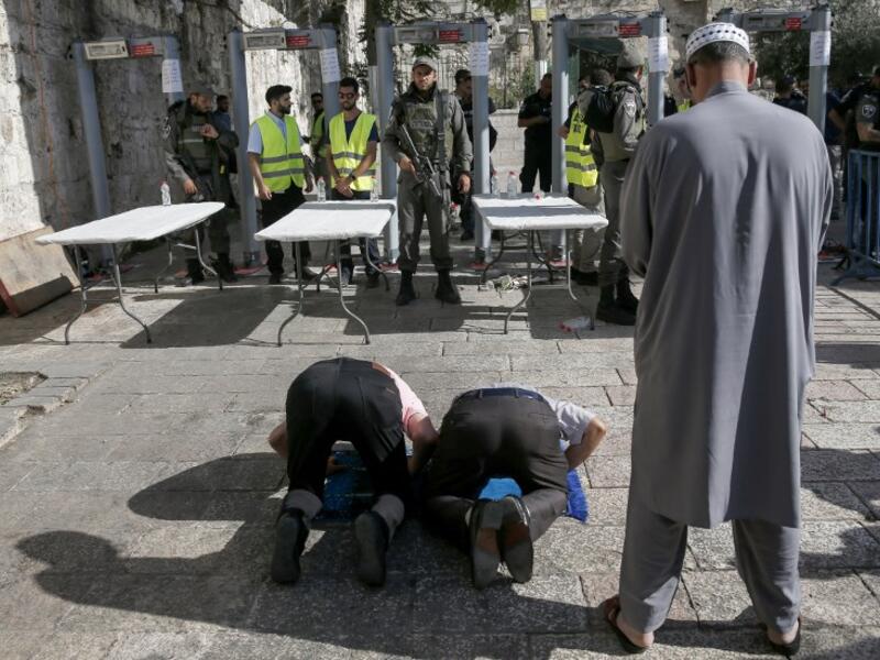 Security measures added by Israel to Al-Aqsa last week sparked Palestinian rage (AFP)