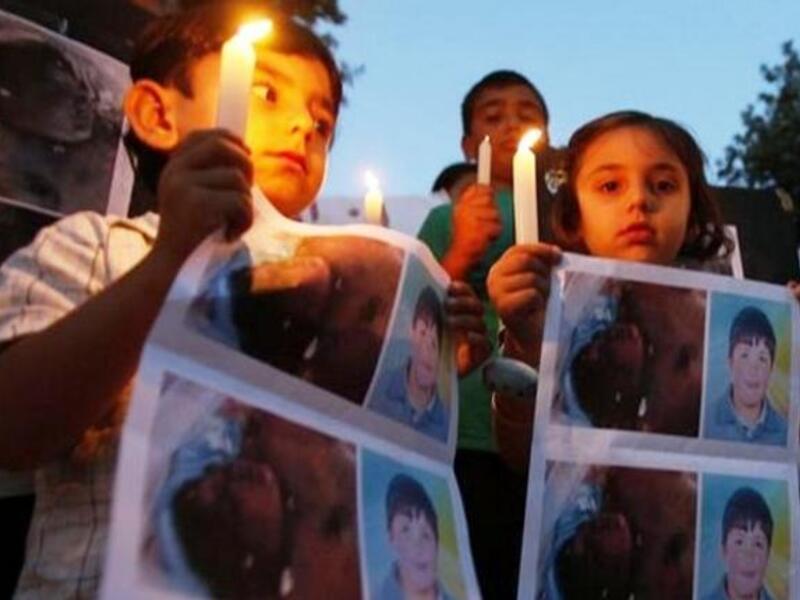 Syria's poster child: Hamza Ali al-Khateeb a round-faced 13 year-old boy vanished from a protest in April, only to show up a month later as a mutilated corpse. His battered purple face and gashed, burn-marked, 
bullet-ridden skin speak of torture before death. His penis was had been chopped off.
