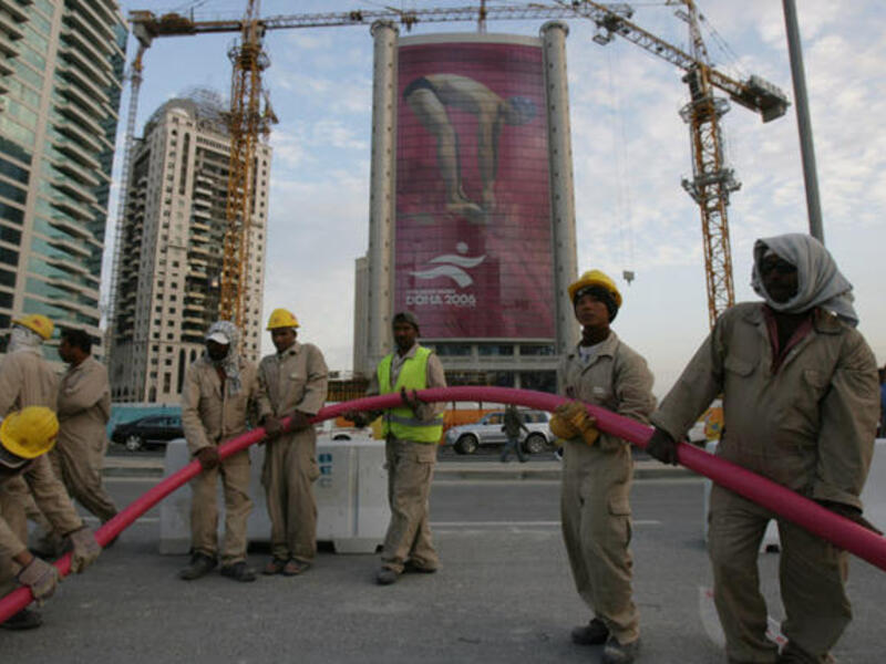 Construction workers in Doha prepare for 2022 international sporting event (File Archive)