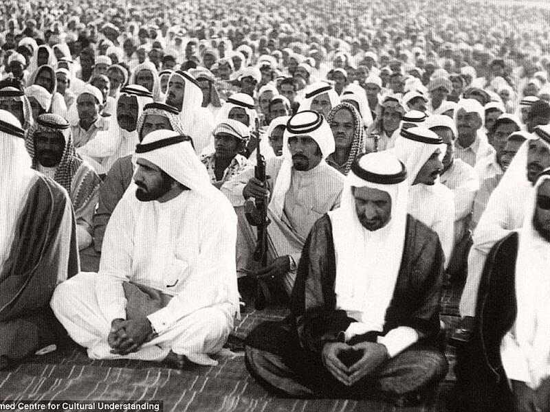 Men reciting prayers for the Muslim festival of Eid in Dubai, ca. 1960s