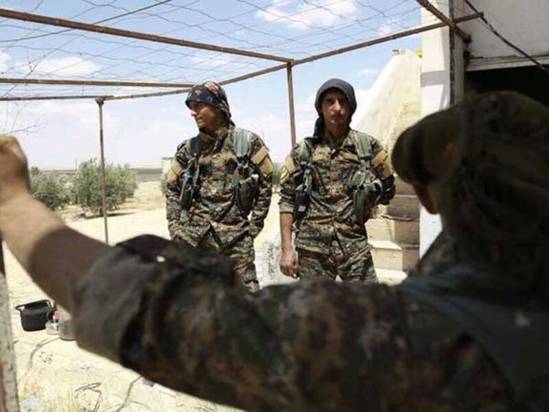 SDF fighters near Manbij, Syria (AFP/Delil Souleiman)