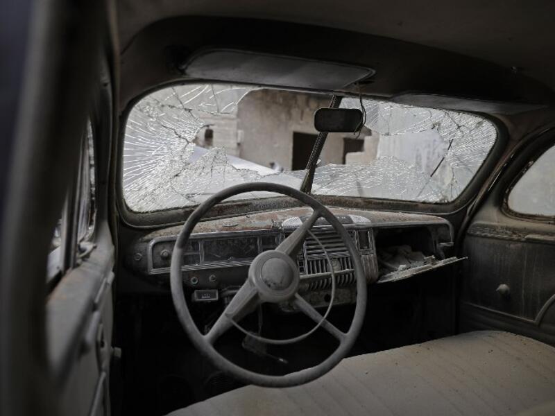 The interior of the 1947 Plymouth parked outside the home of Mohammed Mohiedin Anis, or Abu Omar in Aleppo's formerly rebel-held al-Shaar neighborhood. Once a wealthy man, he owned around 30 classic cars, mostly vintage American cars from the 1940s and 1950s. 