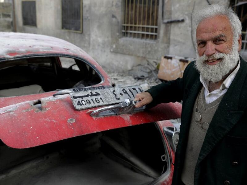 70-year-old Mohammed Anis opens the trunk of his 1949 Hudson Commodor outside his home in Aleppo. Most of his cars have either been damaged by shelling in the war or stolen by fighters. He left Aleppo just two months before the eastern part of the city fell to government forces, but later returned, vowing to restore his “wounded” cars. 
