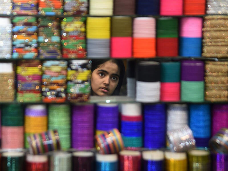 Wearing colorful bangles and putting on Henna during Eid is popular among women in Pakistan. Preparing the perfect outfit continues until the last moment. However, this year’s raising food prices have made it difficult for some to afford the extra expenses. Karachi on June 23, 2017. 