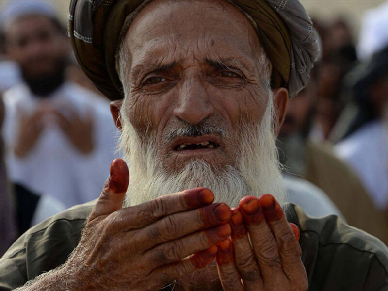 An Afghan resident offers prayers at the start of the Eid el-Fitr holiday at open air mosque on the outskirts of Jalalabad on June 25, 2017. Afghanistan has witnessed the deadliest Ramadan since 2001, with 200 people killed and hundreds wounded. This year, many people have avoided large public gatherings out of fears for further attacks.