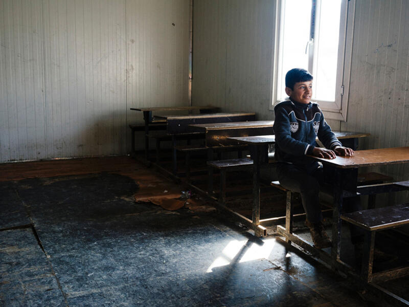 An Iraqi boy sits at a desk in a school in eastern Mosul. In January 2017, schools have started to re-open for the first time in three years. Under the control of Daesh, schools were either closed or followed the extremists’ group curricular. As a result, many children have been missing out on education during that time.