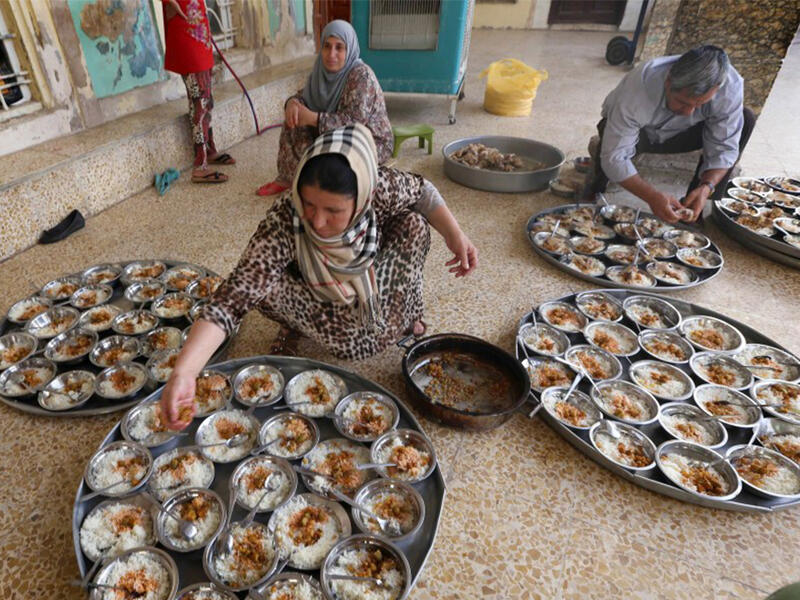 Providing charities, known as Zakat, is an integral part of Ramadan and one of the five pillars of Islam. Here, an Iraqi Kurdish woman prepares the Iftar for families who fled the violence Northern Iraq.