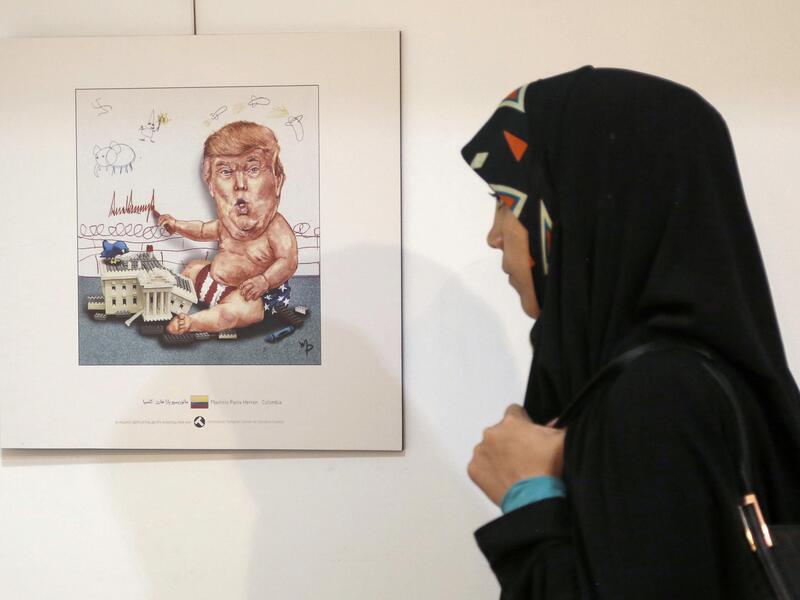 Baby Trump, playing war, drawing KKK stick men and swastikas on the wall. (AFP)