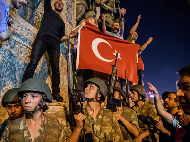 A failed coup: Turkish soldiers pose with a flag at Istanbul’s Taksim Square during an unsuccessful bid to topple the government of Recep Tayyip Erdogan.