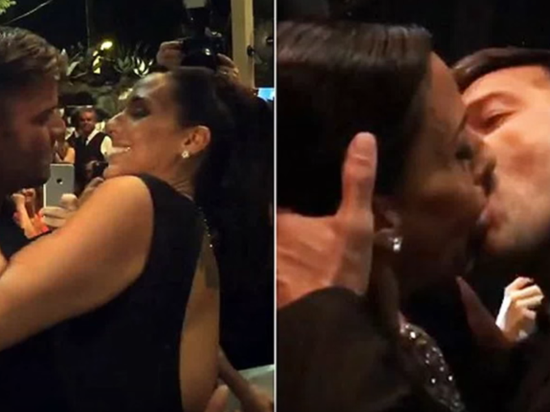 At your service: Female fan pays $90,000 to kiss Ricky Martin on the lips at AIDS charity fundraiser. (YouTube)