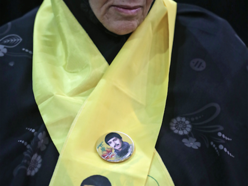 A Lebanese woman wears a scarf with the Hezbollah flag colours as she attends a gathering for a televised speech held by the Shiite party in the capital Beirut, commemorating the party's killed leaders, on February 16, 2018. 
(JOSEPH EID / AFP)